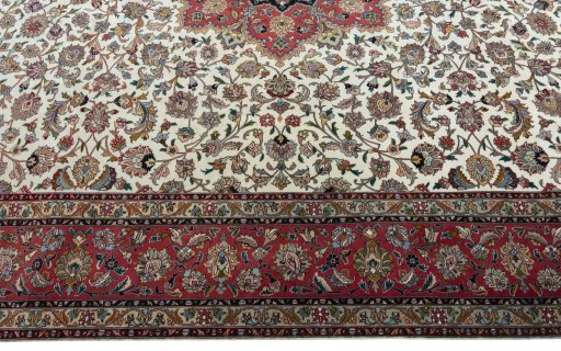 Corner detail of 2000s Tabriz 50/60/70 Raj rug showing border pattern and Cork pile