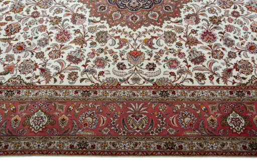 Corner detail of 2000s Tabriz 50/60/70 Raj rug showing border pattern and Cork pile