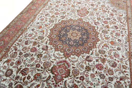 Backside of handmade 2000s Tabriz 50/60/70 Raj rug showing knot structure and weave density