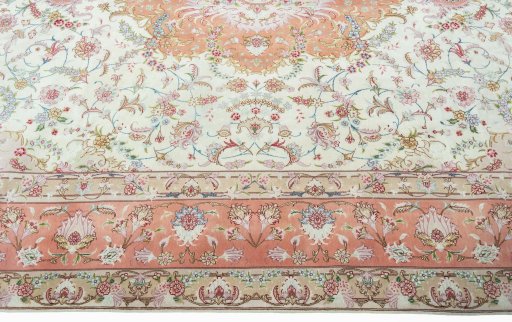 Corner detail of 2000s Tabriz 50/60/70 Raj rug showing border pattern and Cork pile