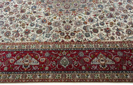 Corner detail of 2000s Tabriz 50/60/70 Raj rug showing border pattern and Cork pile