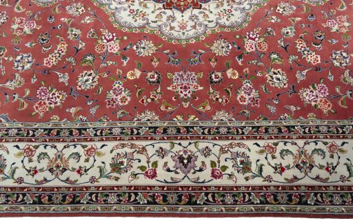 Corner detail of 2000s Tabriz 50/60/70 Raj rug showing border pattern and Cork pile