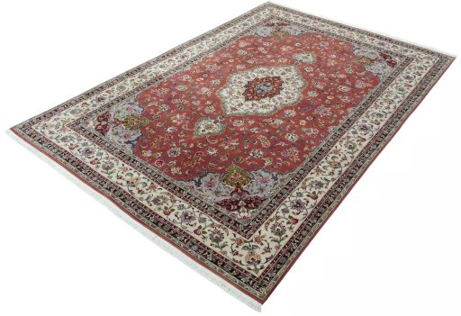 Corner detail of 2000s Tabriz 50/60/70 Raj rug showing border pattern and Cork pile