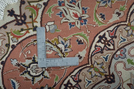 Corner detail of 2000s Tabriz 50/60/70 Raj rug showing border pattern and Cork pile