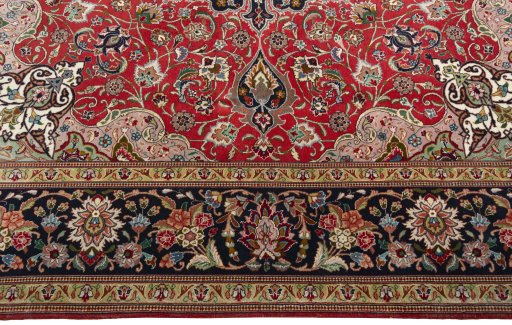 Corner detail of 2000s Tabriz 50/60/70 Raj rug showing border pattern and Cork pile
