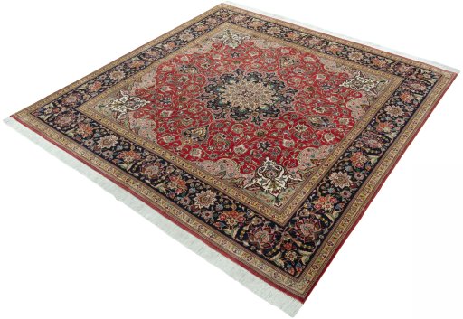 Corner detail of 2000s Tabriz 50/60/70 Raj rug showing border pattern and Cork pile