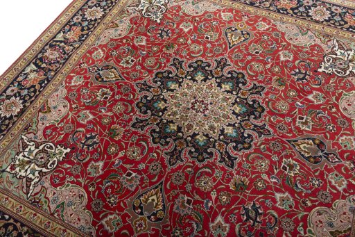 Backside of handmade 2000s Tabriz 50/60/70 Raj rug showing knot structure and weave density