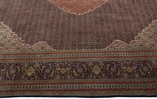 Corner detail of 1970s Tabriz 50/60/70 Raj rug showing border pattern and Cork pile