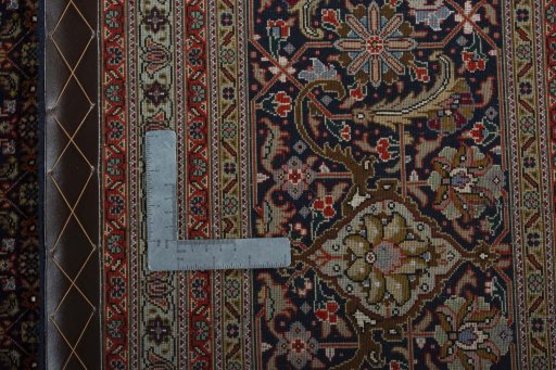 Backside of handmade 1970s Tabriz 50/60/70 Raj rug showing knot structure and weave density
