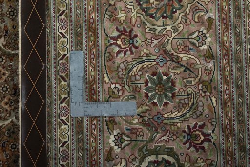 Backside of handmade 2000s Tabriz 50/60/70 Raj rug showing knot structure and weave density