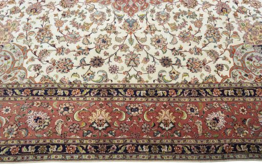 Corner detail of 2000s Tabriz 50/60/70 Raj rug showing border pattern and Cork pile