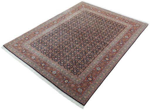 Corner detail of New Tabriz 50/60/70 Raj rug showing border pattern and Cork pile