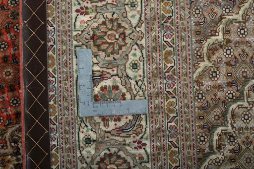 Backside of handmade New Tabriz 50/60/70 Raj rug showing knot structure and weave density