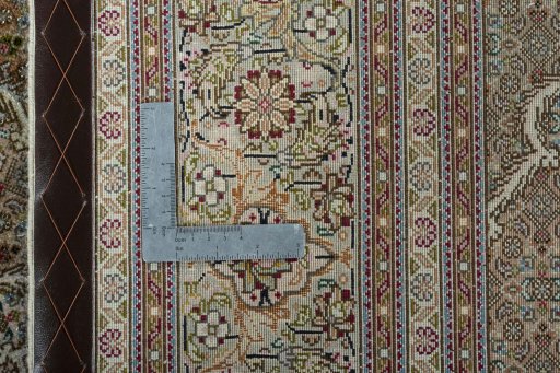 Backside of handmade New Tabriz 50/60/70 Raj rug showing knot structure and weave density