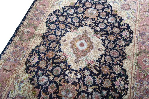 Backside of handmade New Tabriz 50/60/70 Raj rug showing knot structure and weave density