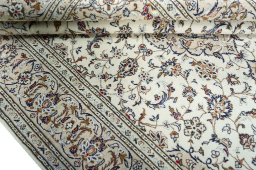 Close-up detail of 2000s Kashan rug from Iran / Persia showing Wool weave