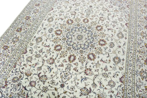 Backside of handmade 2000s Kashan rug showing knot structure and weave density