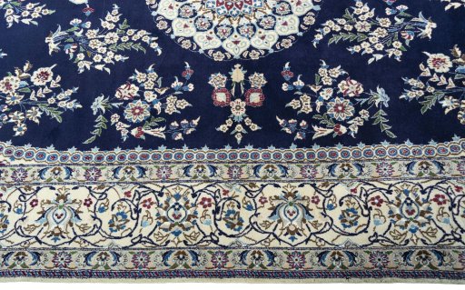 Corner detail of 2000s Nain rug showing border pattern and Wool pile