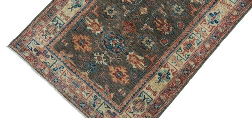 Backside of handmade New Kazak rug showing knot structure and weave density