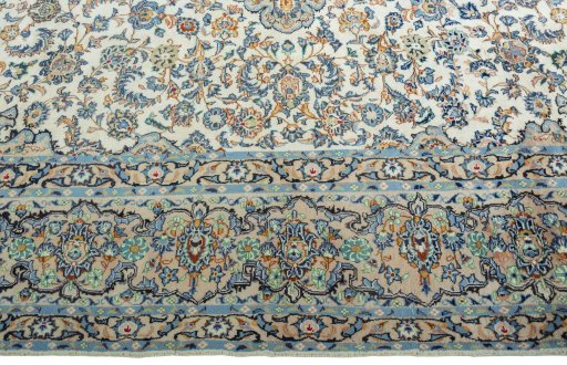 Corner detail of 2000s Yazd rug showing border pattern and Wool pile