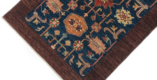 Backside of handmade New Farahan rug showing knot structure and weave density
