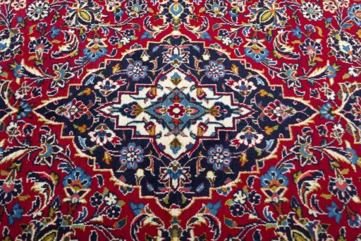 Central medallion detail of 2000s Kashan rug from Iran / Persia