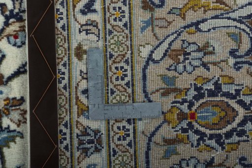 Backside of handmade 2000s Kashan rug showing knot structure and weave density