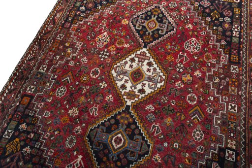 Backside of handmade 2000s Shiraz rug showing knot structure and weave density