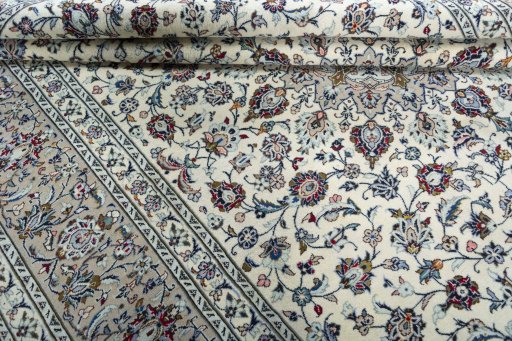 Close-up detail of 2000s Kashan rug from Iran / Persia showing Wool weave
