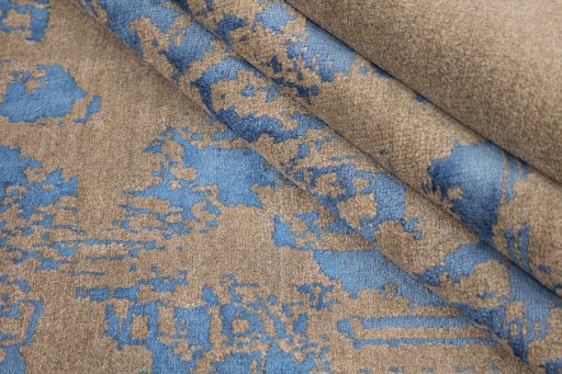 Corner detail of New Organic rug showing border pattern and Wool pile