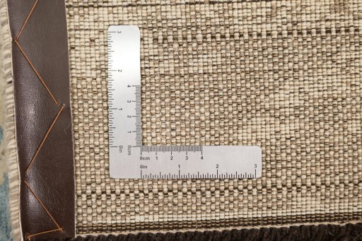Corner detail of New Organic rug showing border pattern and Wool pile