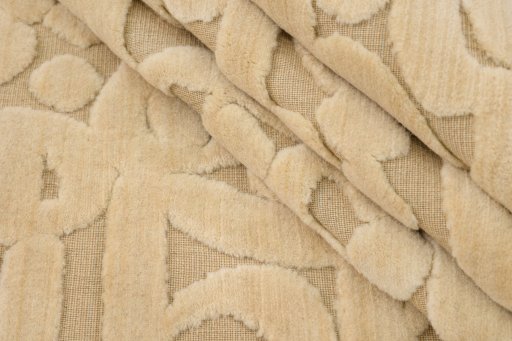 Corner detail of New Organic rug showing border pattern and Wool pile