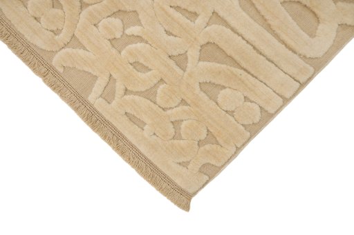 Backside of handmade New Organic rug showing knot structure and weave density