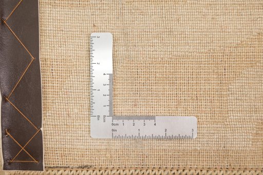 Corner detail of New Organic rug showing border pattern and Wool pile
