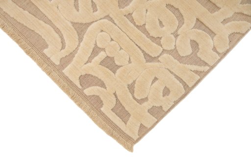 Backside of handmade New Organic rug showing knot structure and weave density