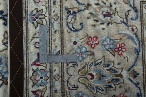 Backside of handmade 2000s Kashan rug showing knot structure and weave density