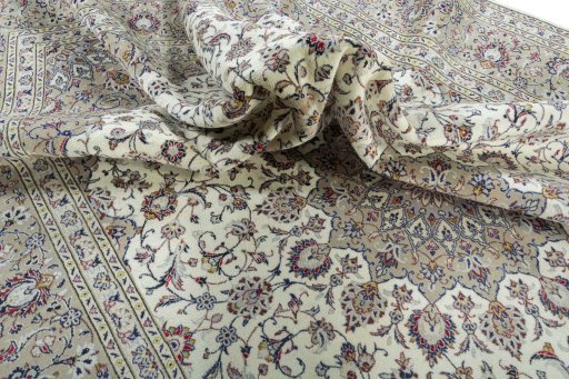 Surface texture of 2000s Kashan rug with natural Wool and intricate pattern