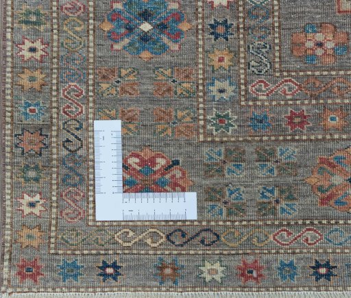 Corner detail of New Kazak rug showing border pattern and Wool pile