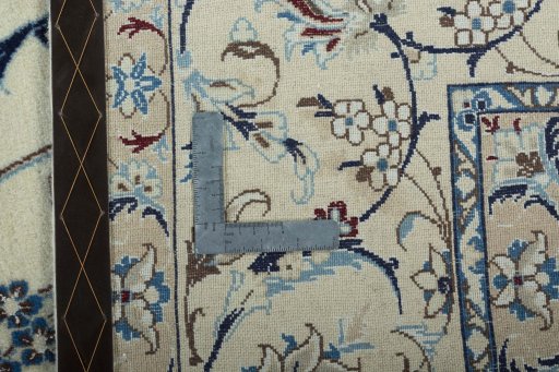 Backside of handmade 2000s Nain rug showing knot structure and weave density