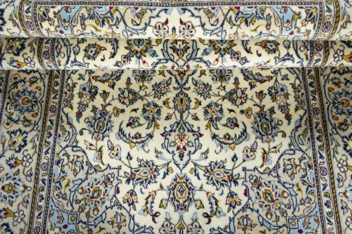 Close-up detail of 2000s Kashan rug from Iran / Persia showing Wool weave