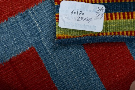 Corner detail of New Kilim Sofre rug showing border pattern and Wool pile