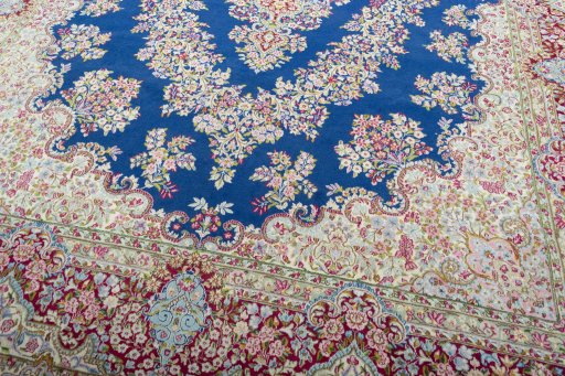 Close-up detail of 1970s Kerman rug from Iran / Persia showing Wool weave