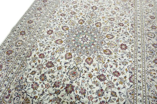 Backside of handmade 2000s Kashan rug showing knot structure and weave density