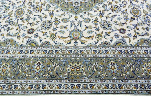 Corner detail of 2000s Kashan rug showing border pattern and Wool pile