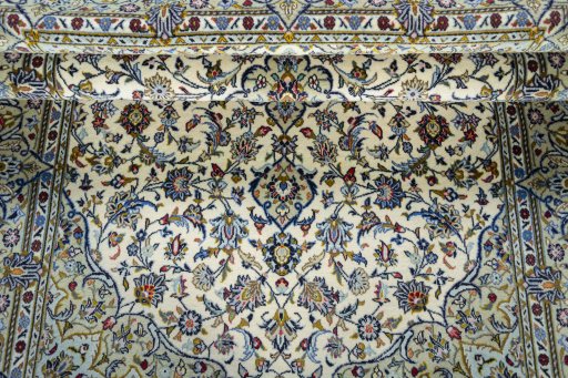 Surface texture of 2000s Kashan rug with natural Cork and intricate pattern