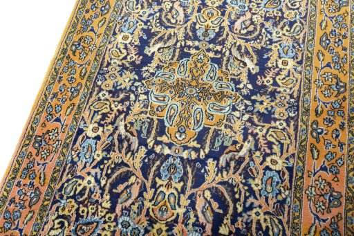 Backside of handmade 1970s Ghom rug showing knot structure and weave density