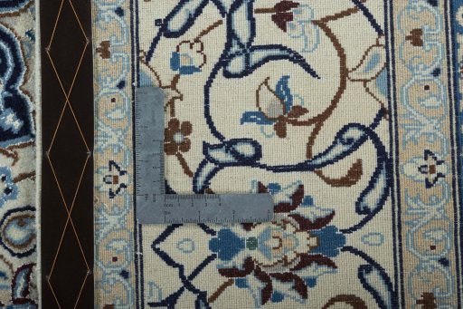 Backside of handmade 2000s Nain rug showing knot structure and weave density