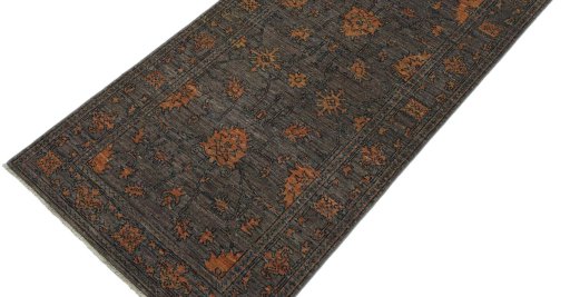 Backside of handmade New Farahan rug showing knot structure and weave density