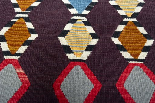 Backside of handmade New Modern Design rug showing knot structure and weave density