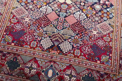 Close-up detail of 2000s Kashan rug from Iran / Persia showing Wool weave